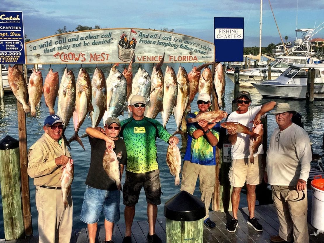 A group of fisherman showing off thier massive catch of fish in the areas of Venice, Sarasota, Siesta Key, & Englewood, Florida